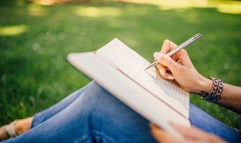 woman writing SMARTER goals